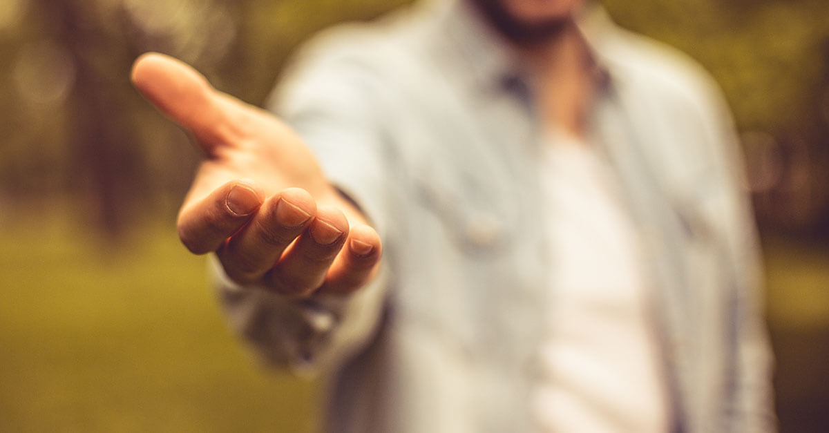 man with hand reaching out